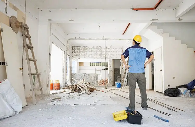 Builder assessing renovation site for Builders Cromwell's Renovations Cromwell service.