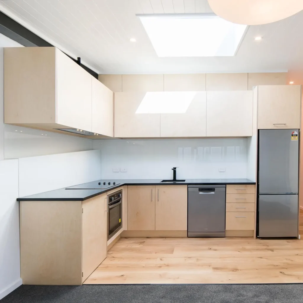 Bright, modern kitchen renovation with wooden flooring by Kitchen Renovations Cromwell.